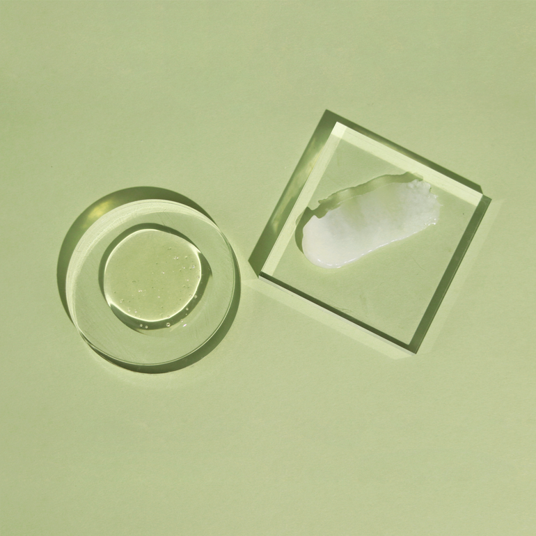 Actiiv Renew Healing Shampoo Treatment and Healing Conditioner dispensed onto glass to show product texture