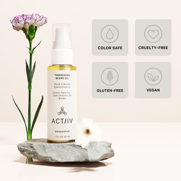 ACTIIV Unscented thickening beard oil bottle with a flower on a beige background