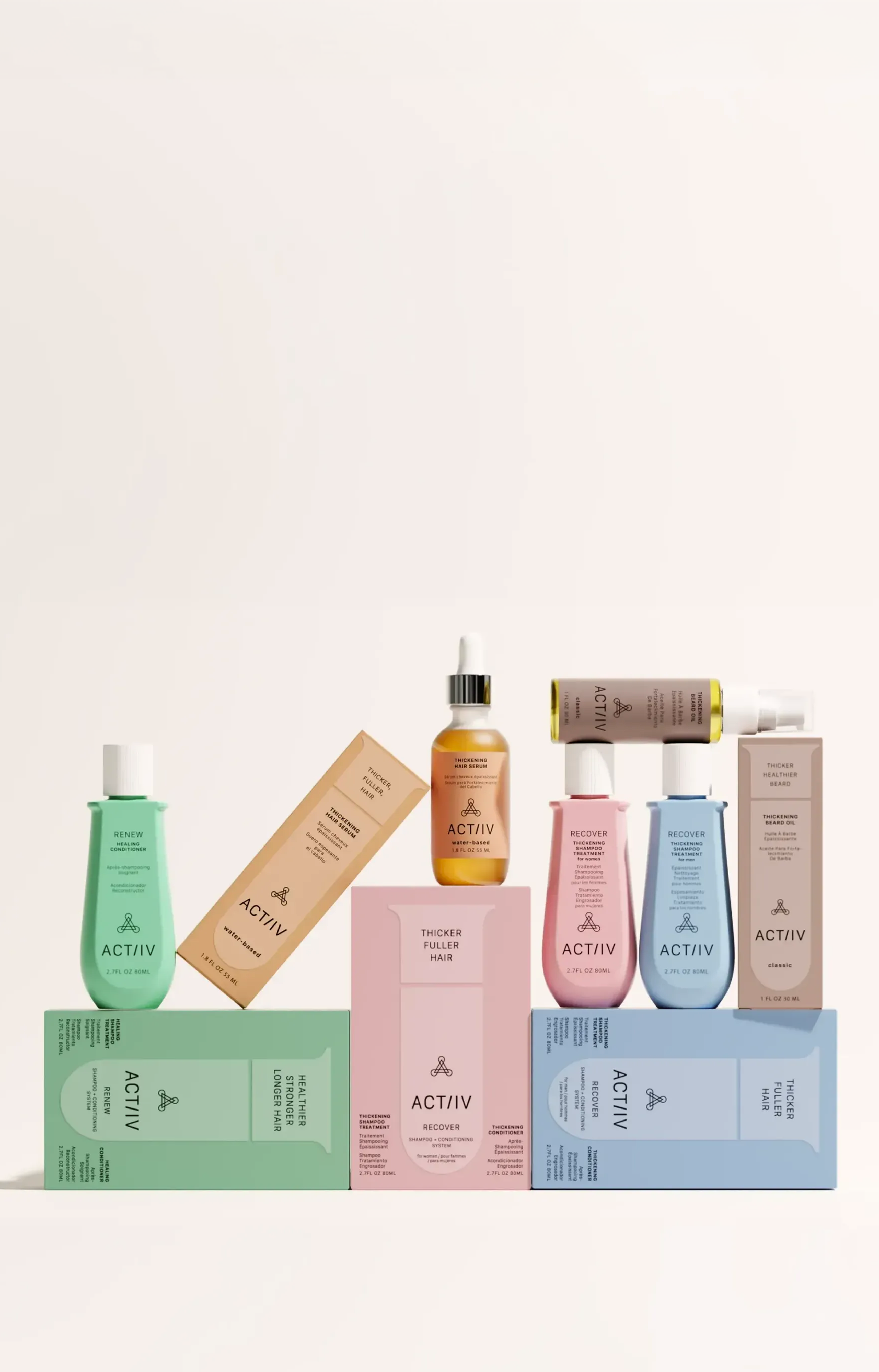 ACTIIV plant-based hair care collection featuring Recover Thickening Shampoo for Women and Men, Renew Healing Shampoo and Conditioner, Thickening Hair Serum, Thickening Beard Oil, and Defense SPF Hair, Scalp + Skin Spray in pastel packaging on a neutral background.