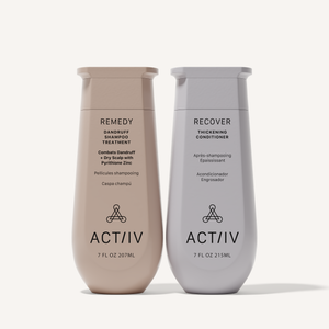 ACTIIV Remedy Dandruff Shampoo Treatment and Recover Thickening Conditioner duo in neutral beige and soft gray bottles, featuring plant-based scalp care and hair thickening products (7 fl oz), front-facing packaging on a clean warm background.