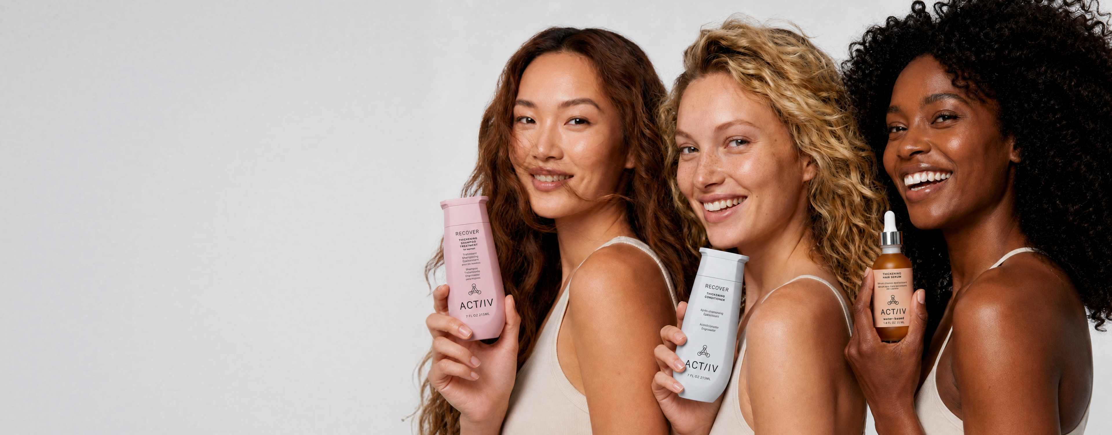 ACTIIV hair care collection featuring Recover Thickening Shampoo, Recover Conditioner, and Water-Based Hair Serum displayed by women with different hair types in a modern studio setting.