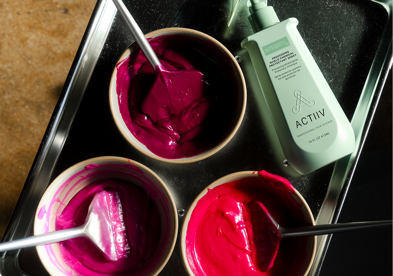 Colour bowls beside ACTIIV product at a salon education class