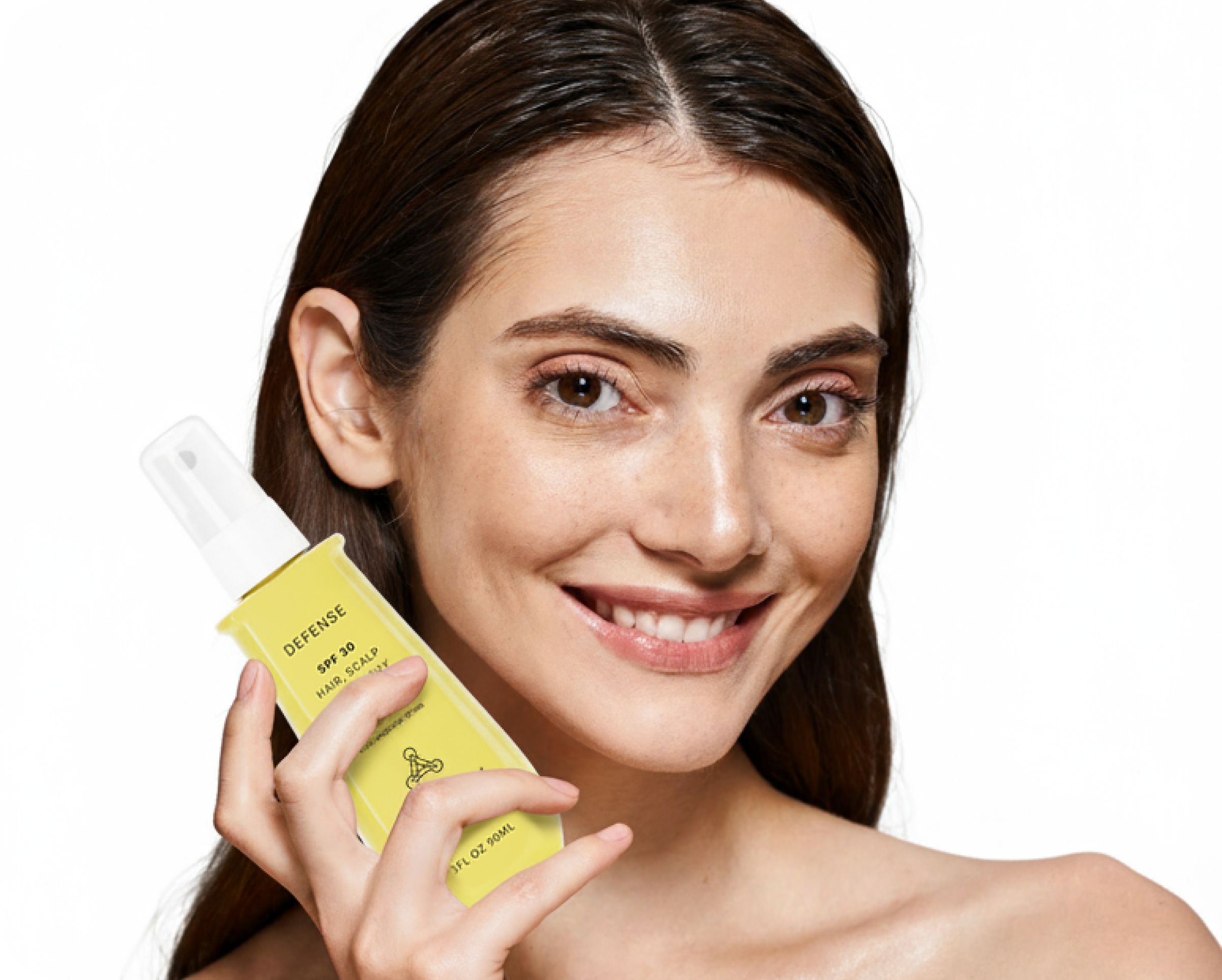 Woman holding an ACTIIV defense SPF product with a white background