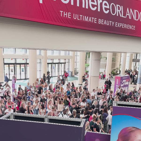 ACTIIV educators on stage at a professional beauty show